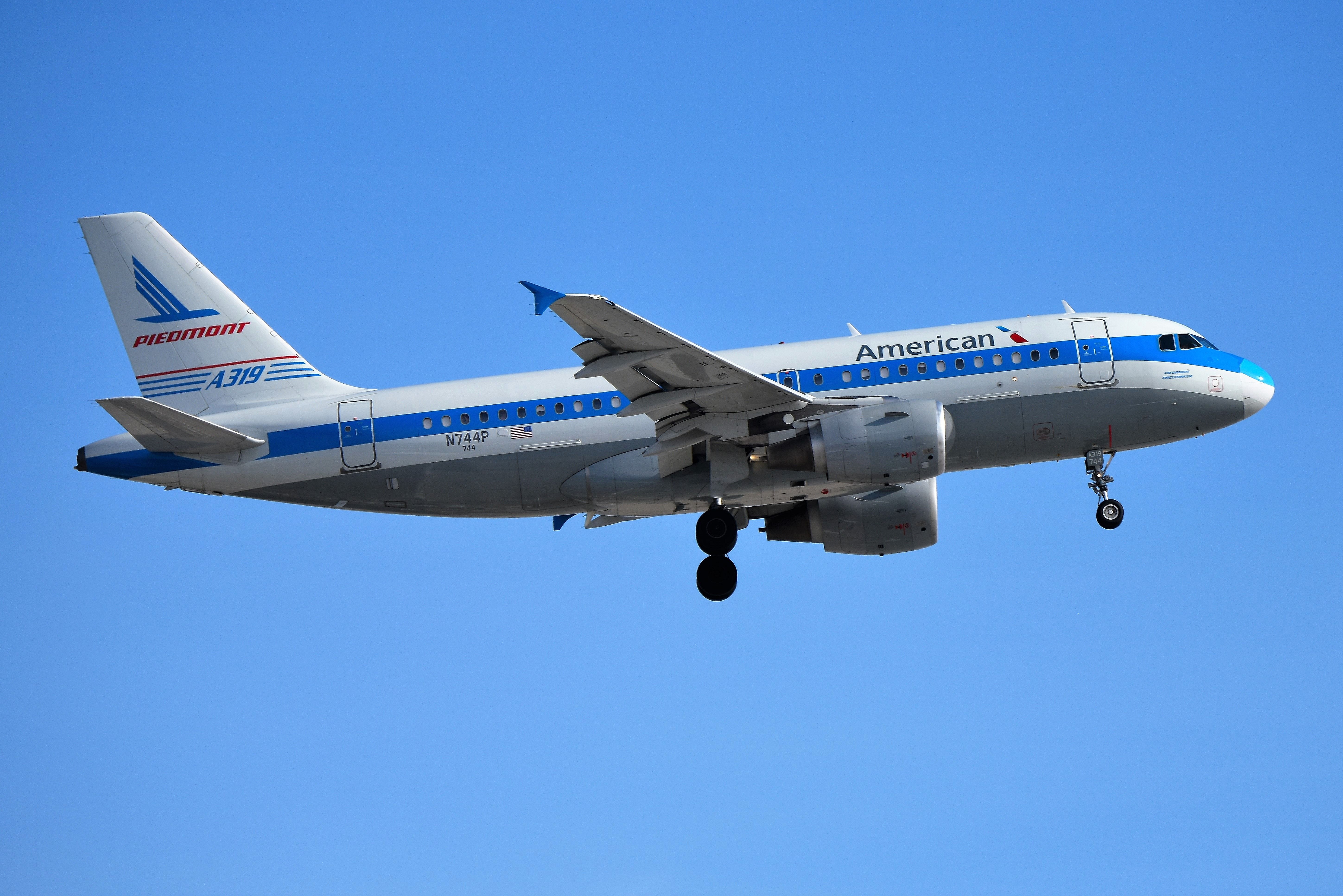 Airbus A319 (N744P) - Piedmont Heritage colors. Landing 23-R on 03-06-19