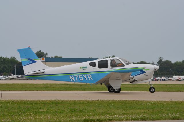 Beechcraft Bonanza (33) (N75YR) - The AOPA Sweepstakes Debonair taxing in after landing at AirVenture 2014.