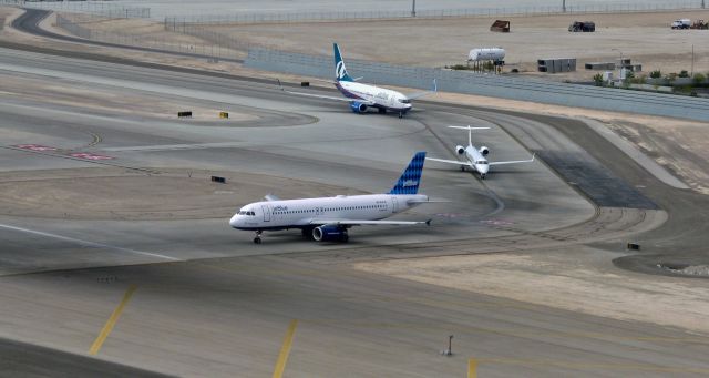 Airbus A320 (N641JB) - Flashback just under 16 years ago to: Oct 2009br /JBU's N641JB, an A320 named "Blue Come Back Now Ya Hear?", is at the head of a three jet queue as it awaits clearance to line up and depart from McCarran International in Las V.br /* Sidenote: The name on the JBU Airbus was derived from the phrase uttered at the end of every episode of an old TV series, "The Beverly Hillbillies."  At the end of every episode, as the final notes of the closing theme song played, an announcer would urge viewers to tune in again to the next episode by saying, "Y'all Come Back Now Ya Hear?"  