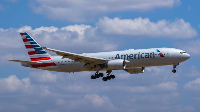 Boeing 777-200 (N795AN) - American Airlines 777-200 landing at DFW airport on 8/6/2022. Taken with a Canon 850D and Rokinon 135mm f/2 lens.