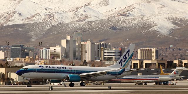 Boeing 737-800 (N280EA) - Easterns N280EA, a B738 and currently one of the five aircraft in Easterns ever-growing fleet, is captured as it flares out to touch tires to the runway 16R concrete to complete its brief early afternoon flight from Elko, Nevada, with Democratic presidential hopeful Bernie Sanders aboard.