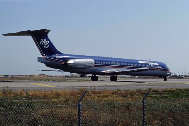 McDonnell Douglas MD-88 (N601ME) - Taxing at San Francisco Intl Airport on 1991/09/11