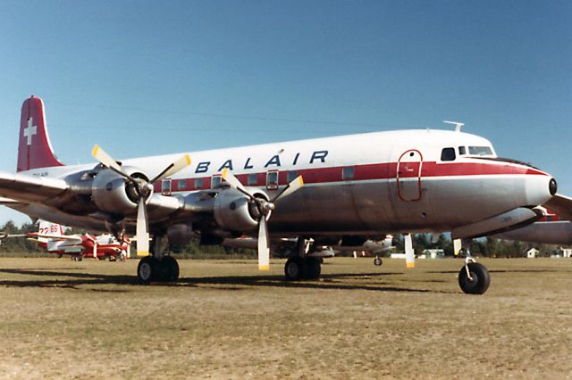 Douglas DC-6 (HB-IBS) - Oct. 1982 - This DC-6 had recently been delivered to Conair for firefighting work, and was subsequently registered as C-GIBS.