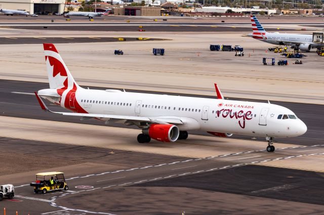 Airbus A321 (C-GJTX) - Air Canada Rouge A321 taxiing at PHX on 11/1/22. Taken with a Canon 850D and Tamron 70-200 G2 lens.