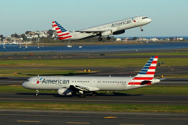 Airbus A321 (N918US) - Double Vision. AA 452 to Phoenix taxiing out for departure as AA 714 departs for Philadelphia