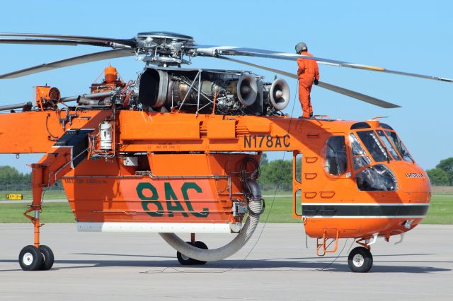 Sikorsky CH-54 Tarhe (N178AC) - "DO NOT START ROTORS YET"....  Crew Chief from Erickson Aviation conducting pre-flight inspection. 