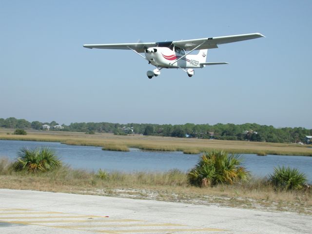 Cessna Skyhawk (N429SP) - Short final to runway 23 at Cedar Key, Floridas George T. Lewis Airport to enjoy a seafood lunch.