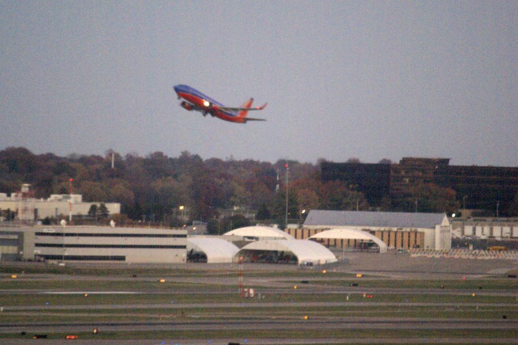 Boeing 737-700 — - Southwest 1844 off to KRSW. Note Boeings other products in the shelters past the runways. (Wouldnt mind a better look at those.)