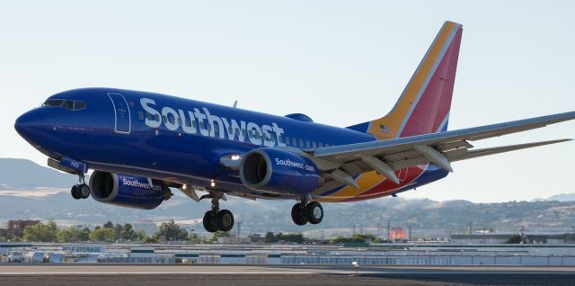 Boeing 737-700 (N7820L) - Another share from yesterday evenings spottting next to the runway 16R PAPI boxes.  (The boxes will be visible in the foreground right next to me in the two pics I post tomorrow.)br /The mains of Southwests N7820L are seeking the 16R concrete in this click taken about 7:20 PM as this SW B737-7 makes its second visit to Reno within 6 hours.  Earlier in the day, at around 1:40 PM, this one arrived from McCarran, and in this snap taken less than 6 hours later, it is completing a KSAN-KRNO trip.