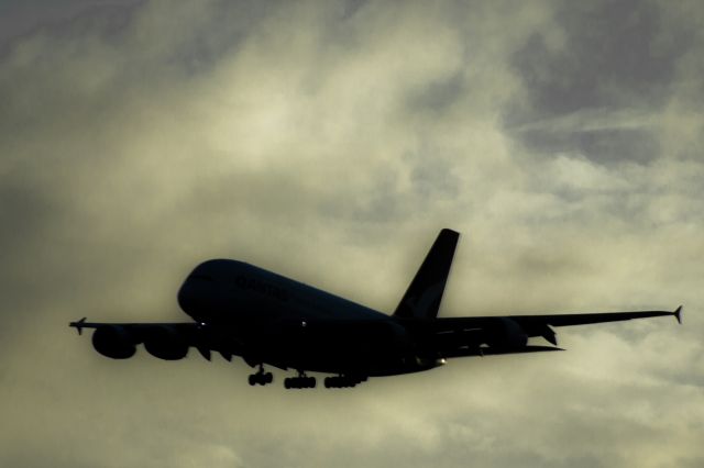 Airbus A380-800 — - Qantas flight arriving to LAX. Was able to take this image against a bright morning sky to make the silhouette.