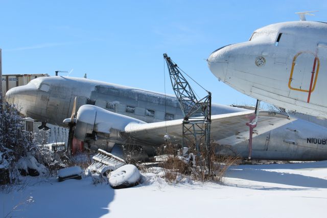 Douglas DC-3 (N100BF) - At Basler Turbo Conversions in the cold March Snow.