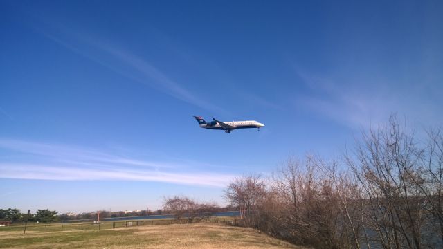 Canadair Regional Jet CRJ-200 (N461AW) - About to land on RWY18. Taken from Gravelly Point.