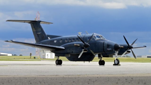 Beechcraft Super King Air 200 (N20KW) - 07-61017 (N20KW), an RC-12W sits idle at KCAK. 