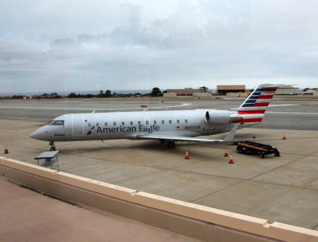 Canadair Regional Jet CRJ-200 (N955SW) - KMRY - early am and the American Eagle Flight awaiting passengers for flight 5518 at noon.