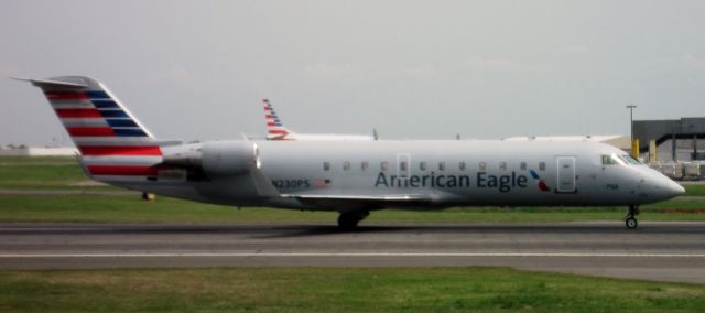 Canadair Challenger (N230PS) - American/PSA Airlines N230PS/JIA5204 on taxi to depart KCLT for KDAY...