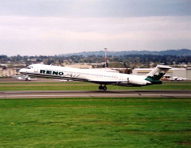 McDonnell Douglas MD-80 (N833RA) - KPDX - Feb 1997 - apprx date - Reno Air departing to the east towards Mt Hood - and most likely headed to KRNO.