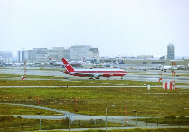 BOEING 767-300 — - KLAX - I'll look the reg up later, but an easterly view from "Hooker Hill" towards 24L and LAX in the distance. I had the 8ft ladder in the back of the pick up truck and the "clientele" that would drive up (usually a male and female) and park a little too close for me, and leave 15 mins later and the "dealers" in their cars made me not want to take photos from here. I did get some good video here one day in 1998 on a rainy day of 6L arrivals from over the Pacific Ocean behind the camera view. This area closed off long ago...
