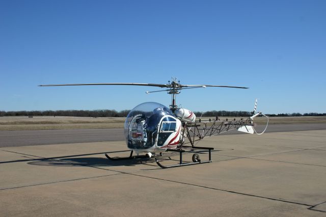 Cessna Commuter (N17SS) - Seldom do you see a 58-year old helicopter in this well maintained condition.  This Bell Model 47 dropped in for fuel before continuing on.