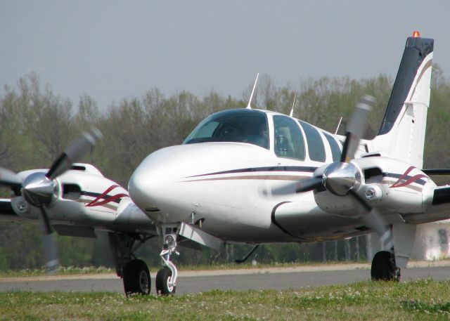 Beechcraft Baron (58) (N767AR) - Taxiing to runway 14 on taxiway Foxtrot at the Shreveport Downtown airport. Call sign was Angel Flight. Unselfish Pilot!