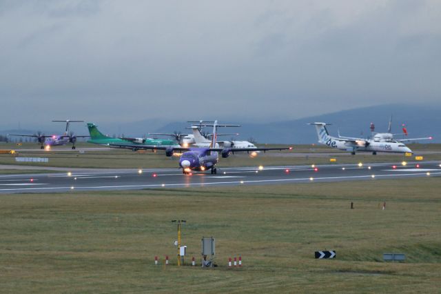 Aerospatiale ATR-72-500 (EI-REL) - A solitary Ryanair B737 in amongst all the DH8, ATR and Do328 in the 9am rush at Manchester.  BEE811 departs to the Isle of Man