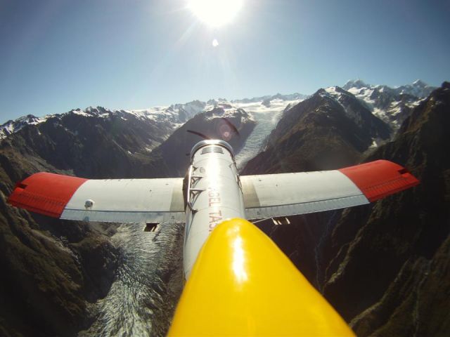 SARGENT-FLETCHER FU-24 (ZK-DJE) - Ascending for Paradrop, Fox Glacier New Zealand. Go Pro on Vert' Stab'