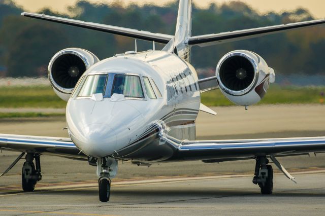 Cessna Citation Excel/XLS (N82HE) - N82HE is a 2009 Cessna 560XL seen here taxiing to the ramp shortly after arriving at Atlanta's PDK executive airport. I shot this with a Canon 500mm lens. Camera settings were 1/6400 shutter, F4, ISO 400. Please check out my other photography. Positive votes and comments are always appreciated. Questions about this photo can be sent to Info@FlewShots.com