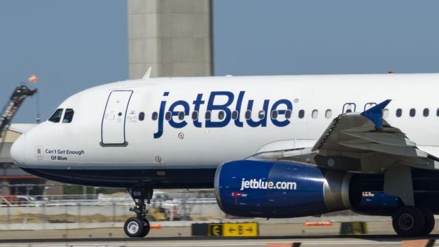 Airbus A320 (N618JB) - Peek a Blue, I see you. Departing 17L