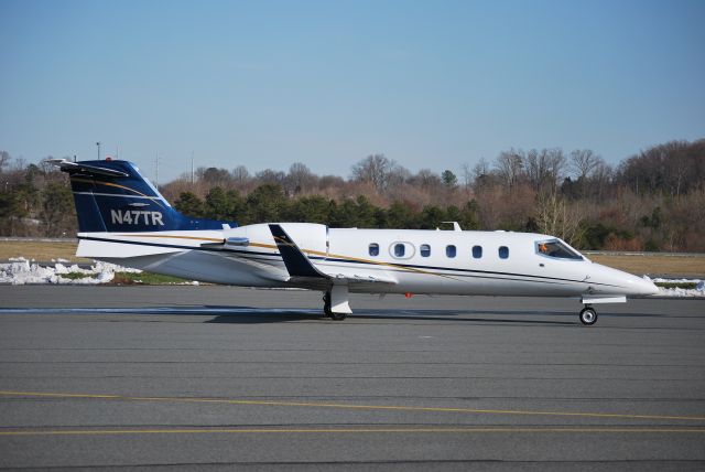 Learjet 31 (N47TR) - Taxiing (NFL Tennessee Titans QB, Kerry Collins) at KJQF - 3/4/09