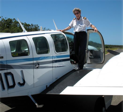 Beechcraft Baron (58) (ZS-MDJ) - Captain Brigitte Cross in Progress Airs Baron.