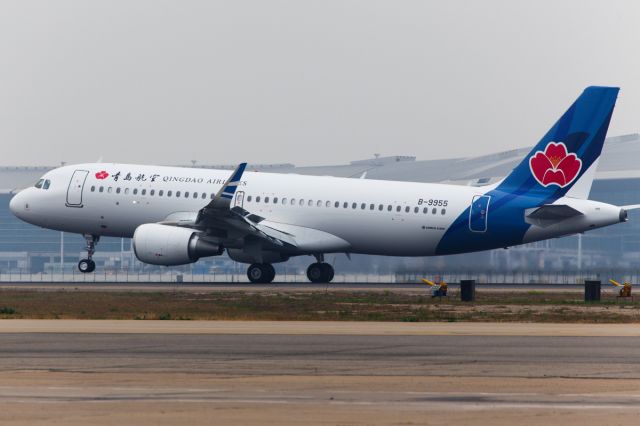 Airbus A320 (B-9955) - The first A320 of Qingdao Airlines arrived at Tianjing Binhai International Airport on 2014.4.14.