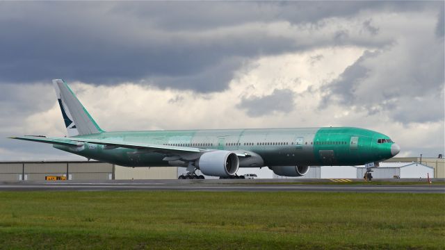 BOEING 777-300 (B-KQJ) - BOE823 taxis to Rwy 34L for a flight to KPDX for painting on 10.8.13. (LN:1147 / cn 41760).