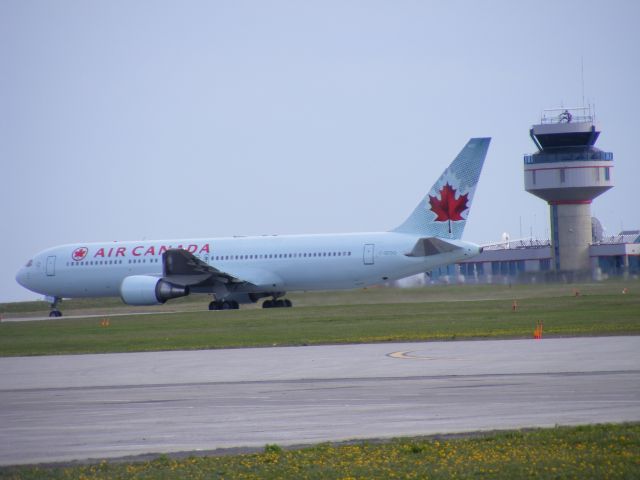 C-GEOQ — - passing Ottawa control tower as it takes off of #14