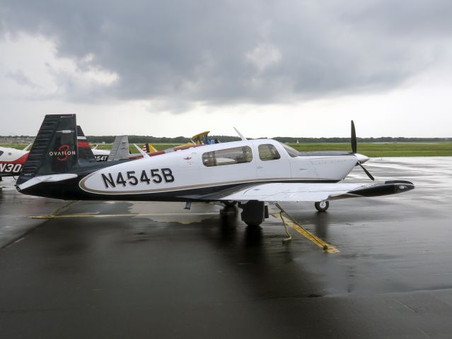 Mooney M-20 (N4545B) - Gathering for the Mooney arrival at Oshkosh. 18 August 2015.