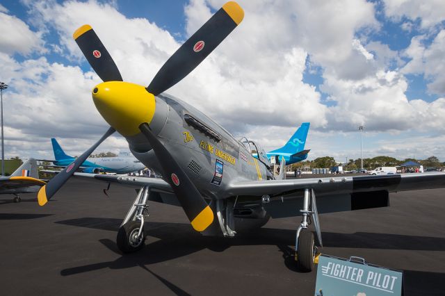 North American P-51 Mustang (VH-FST) - P-51D of Fighter pilot siting on the apron at the 2016 Careers Expo, looking up at the nose here