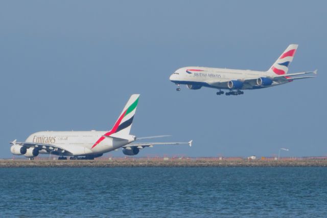 Airbus A380-800 (G-XLEJ) - The BAW A388 (BAW28K) coming in for a landing while UAE41P holds short of 28L.br /br /(BAW28K ARRIVING FROM LHR TO KSFO) (UAE41P DEPARTING FROM KSFO TO DXB)