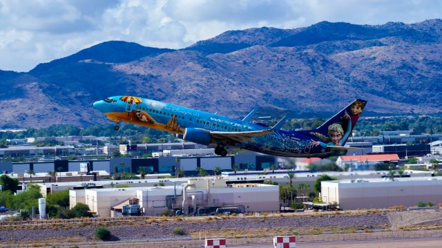 Boeing 737-800 (C-GWSV) - WestJet 737-800 taking off from PHX on 8/20/22. Taken with a Canon 850D and Rokinon 135mm f/2 manual focus lens.