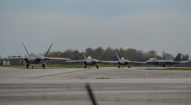 Lockheed F-22 Raptor — - Four F-22s from the 1st Fighter Wing taxiing out at LCK after a 6 day stay to avoid Hurricane Matthew