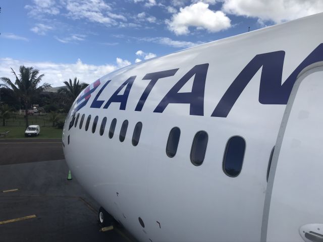 — — - Deplaning onto the tarmac at Mataveri International Airport, Easter Island.