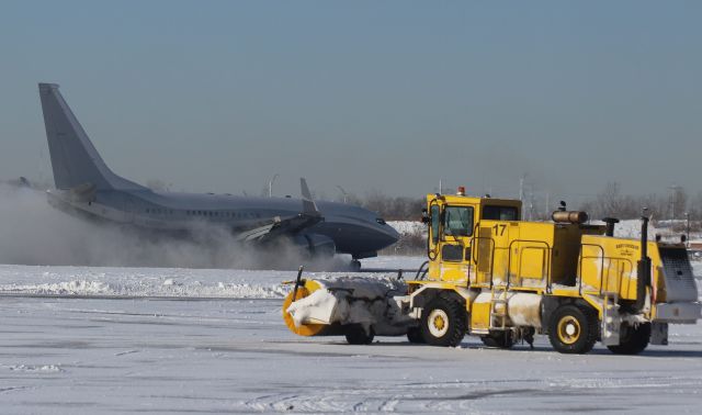 Boeing 737-700 — - Photobombed by Broom 17!! while watching this landing on Runway 30 and snow removal operations on the ramp at Gary Regional Airport.