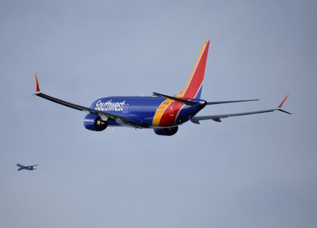 Boeing 737 MAX 8 (N8709Q) - Southwest 737-8 MAX climbing out while a UPS 747-8F flies downwind for DFW.