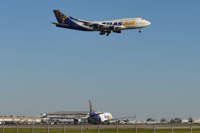 Boeing 747-400 (N480MC) - 10-19-24. Sister ship N322SG on the ground. Brought Jacksonville Jaguars in to town. First time for Atlas to have two pax 747's on the ground at IND at the same time.