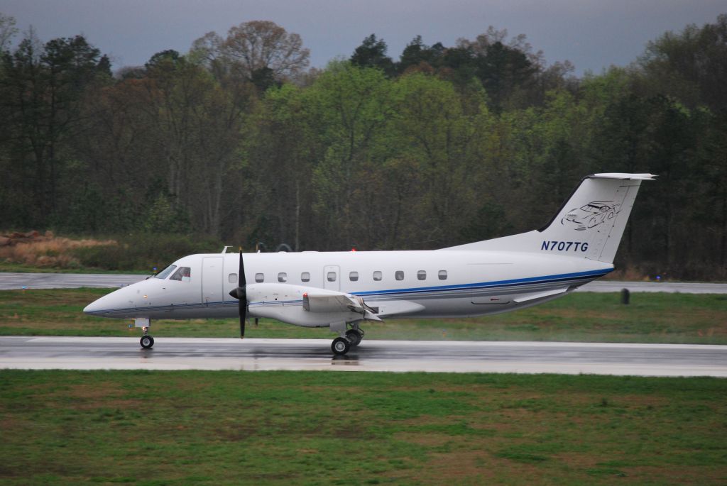 Embraer EMB-120 Brasilia (N707TG) - Rolling down runway 20 (NASCAR team for driver Robby Gordon) - 4/2/09