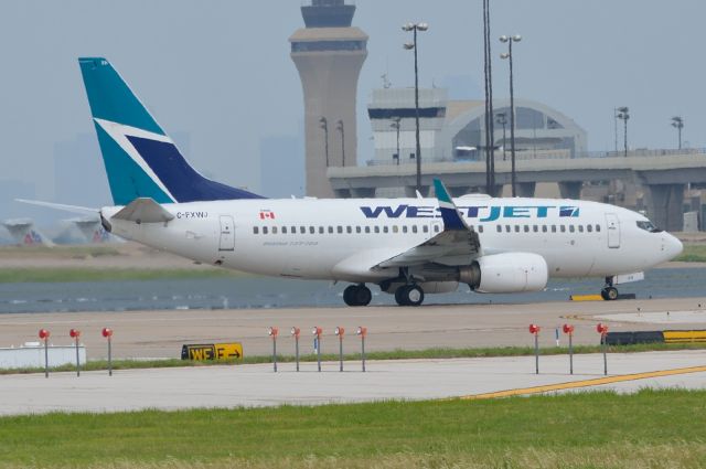 Boeing 737-700 (C-FXWJ) - WestJet - C-FXWJ - Departing KDFW 06/15/2013