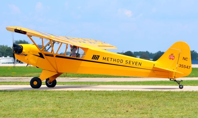 Piper NE Cub (N35547) - Bright yellow Piper Cub departing EAA Airventure 2021.