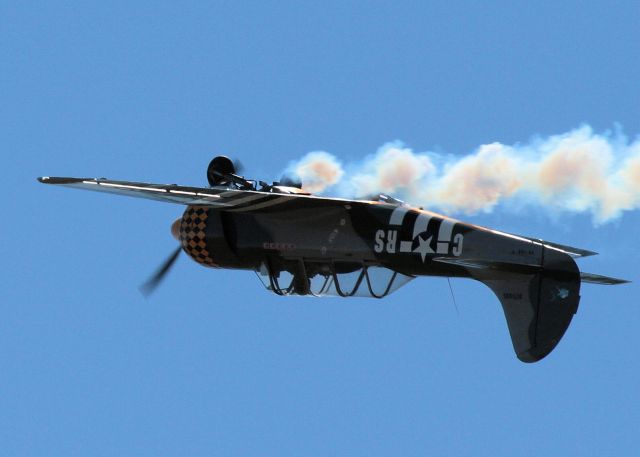 — — - Immersed in his own smoke during airshow routine - I enjoyed the effect of the sun behind the plane and smoke and the shadows it created