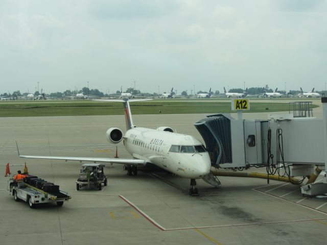 Canadair Regional Jet CRJ-200 (N8884E) - July 4th, you can see all the FedEx jets parked in the background for the holiday.