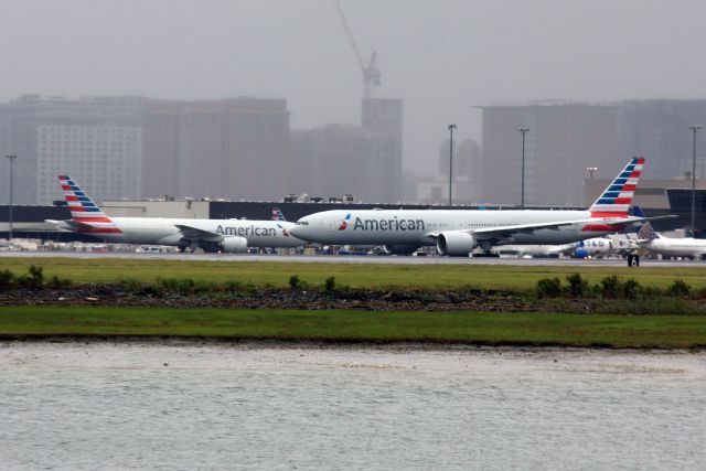 BOEING 777-300ER (N719AN) - Two B777's are better than one: American B777-300 prepares to depart back to JFK after diverting while B777-200 at gate preparing for its flight to LHR on 6/3/23. 