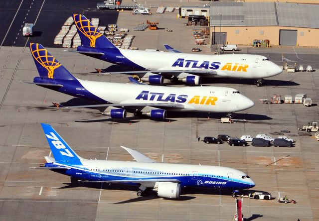 Boeing 787-8 (N787BX) - Aerial view of the new Boeing 787 with a backdrop of two Atlas 747 cargo planes on Huntsville International's cargo ramp.  Photo copyright: Blake Mathis