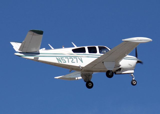 Beechcraft 35 Bonanza (N5727V) - 1966 Beech V35 landing at Downtown Shreveport. New paint since I shot it 7 years ago at Shreveport Regional.