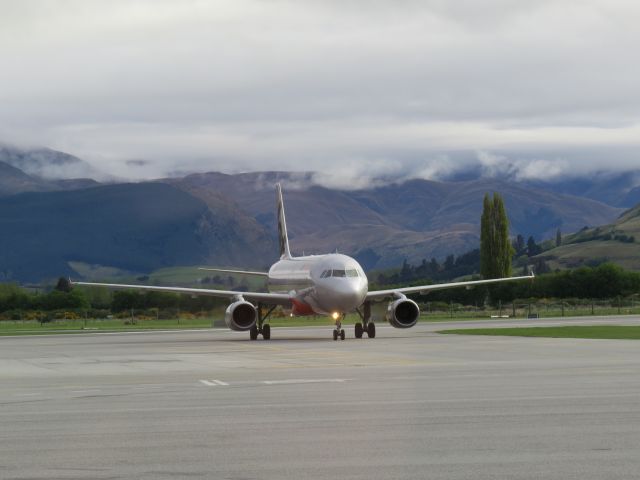 Airbus A320 (VH-VQU) - VH-VQU taxiing at Queenstown Airport.